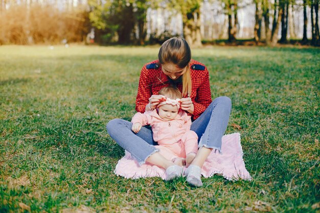 stylish mother with little daughter