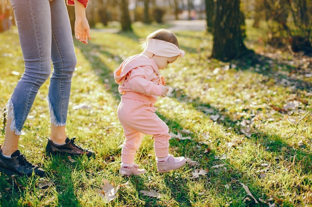 stylish mother with little daughter