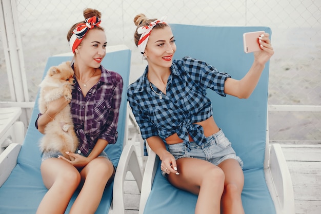 Free Photo stylish pin up girls with the little dog