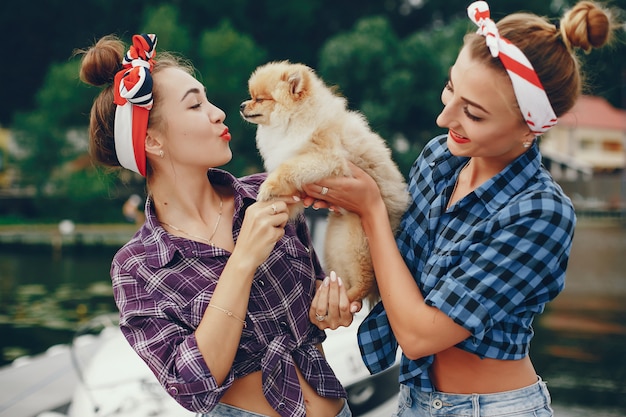 Stylish pin up girls with the little dog