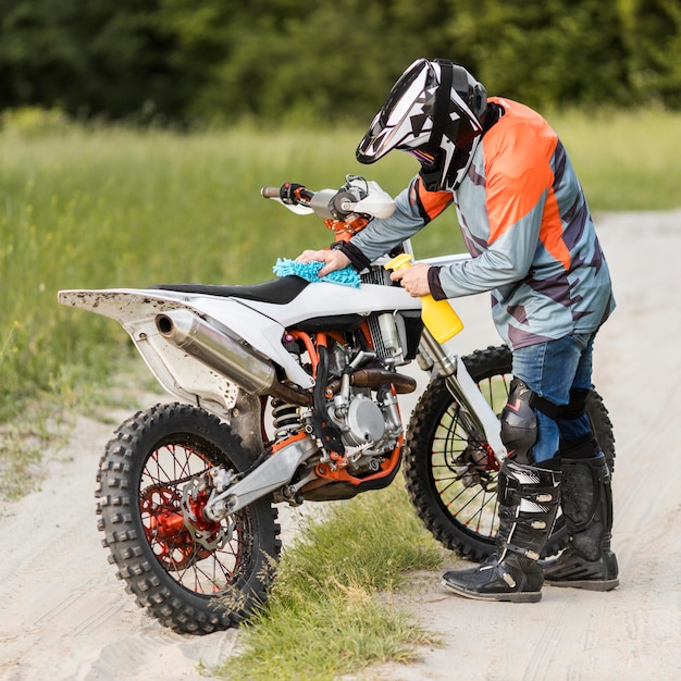 Free Photo stylish rider cleaning motorbike