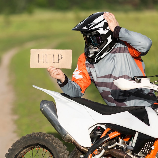 Stylish rider holding help sign