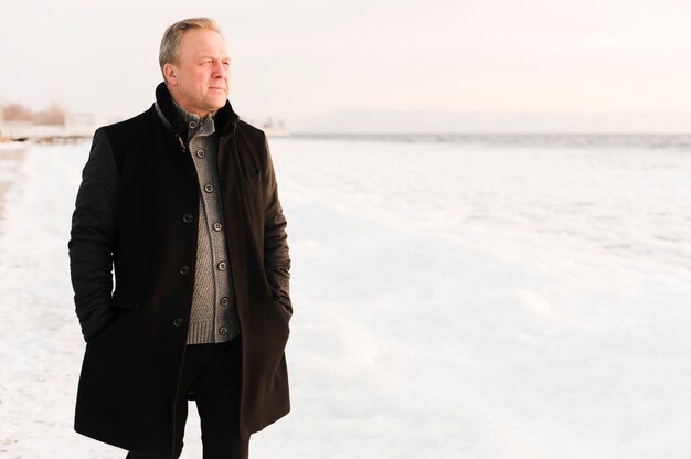 Stylish senior man looking at view