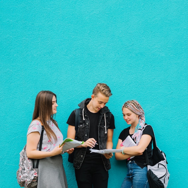 Free photo stylish students posing with books