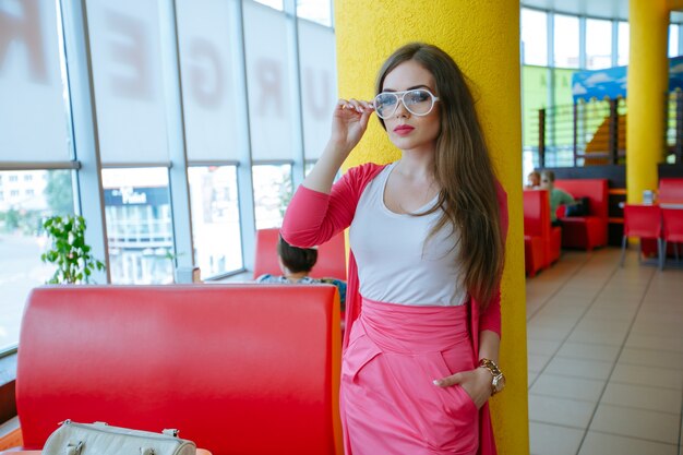 Stylish teenager posing with white glasses