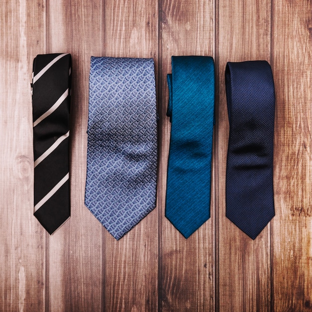 Free photo stylish ties on wooden table