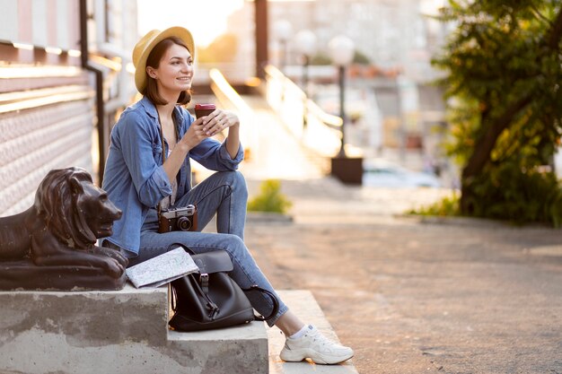 Stylish tourist enjoying taking pictures on holiday