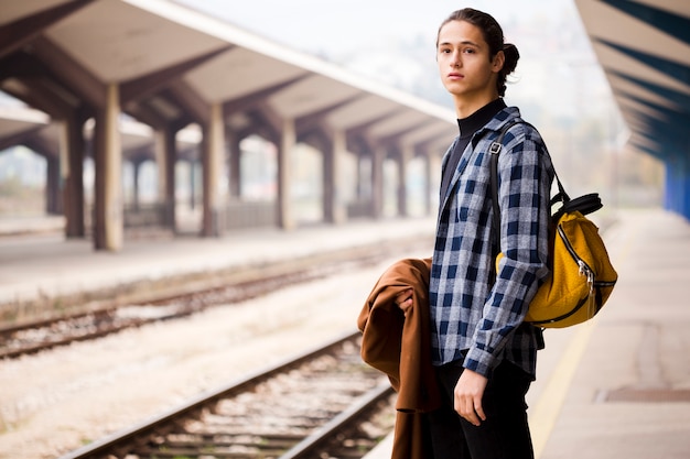 Stylish traveler at the railway station