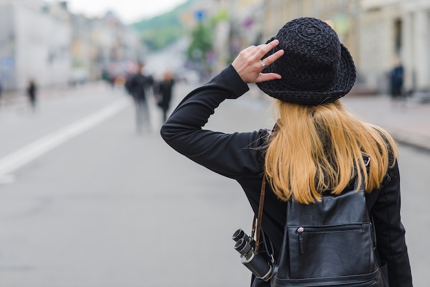 Free photo stylish woman on city street