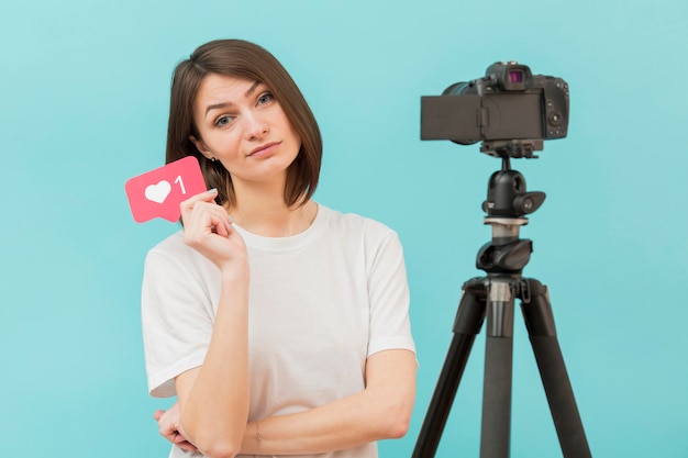 Stylish woman getting ready to film at home