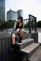 Free photo stylish woman in k-pop clothing in urban scene