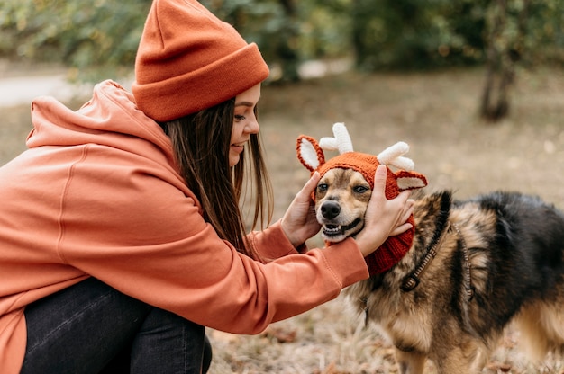 Stylish woman out for a walk with her dog