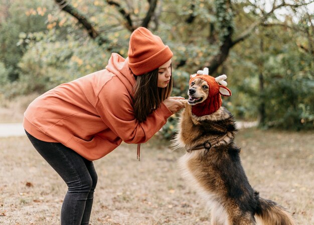 Stylish woman out for a walk with her dog