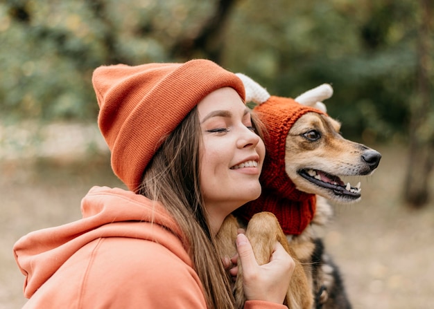 Stylish woman out for a walk with her dog