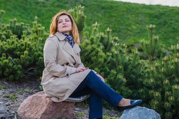 Stylish woman posing in the park