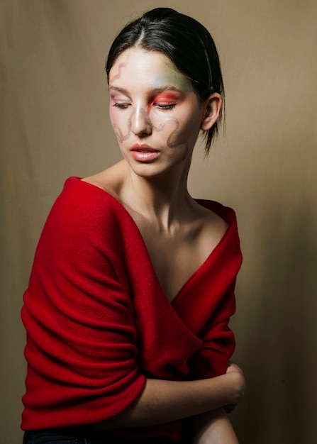 Free photo stylish woman posing in red blouse