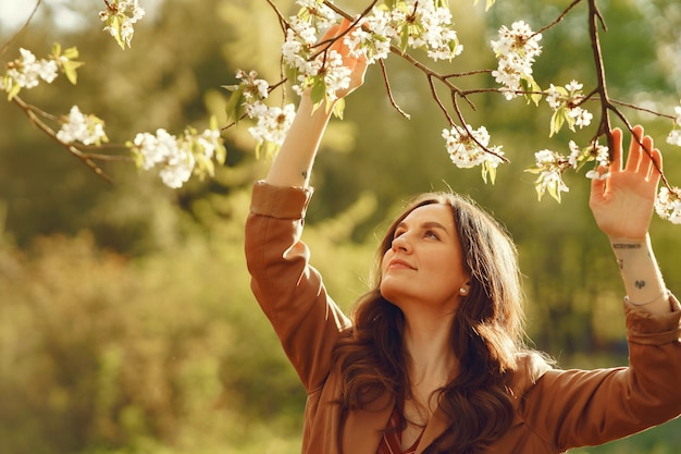 Stylish woman spending time in a spring park