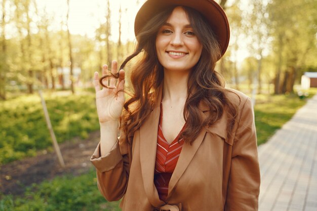 Stylish woman spending time in a spring park