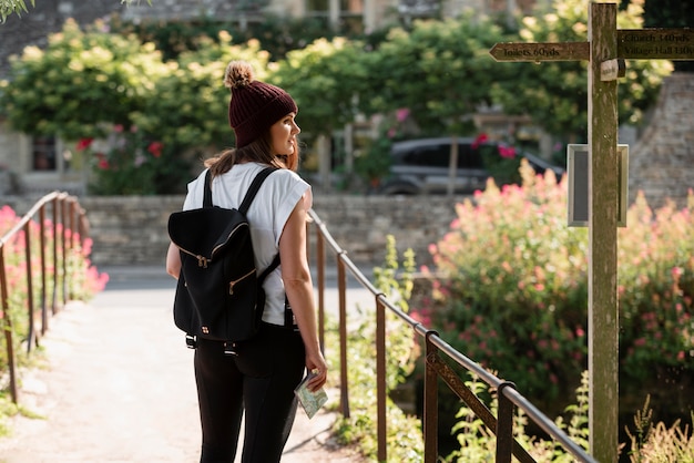 Stylish woman with map for traveling