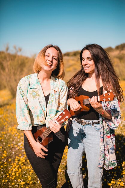 Stylish women with ukuleles