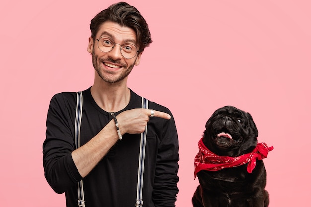 Stylish young man and his cute dog