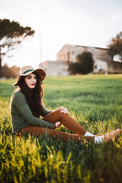 Free photo stylish young model on grass