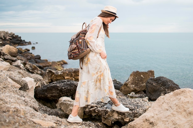 Free photo stylish young woman enjoying vacation