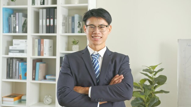 Successful Asian business man in office background business professional and confidence