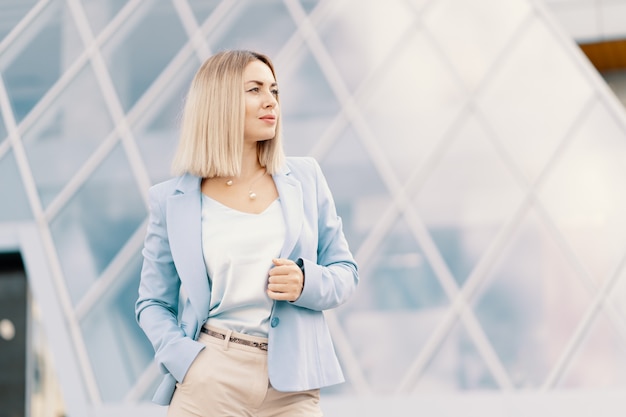 Free Photo successful business woman in blue suit