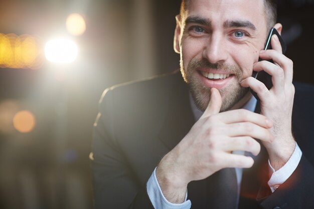 Successful Businessman Calling by Smartphone