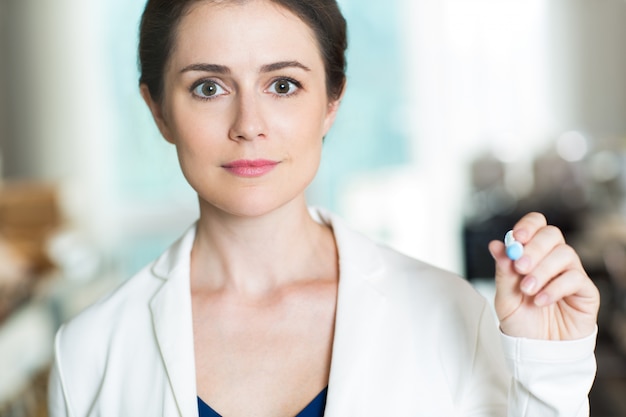 Successful Businesswoman Writing on Glass Screen