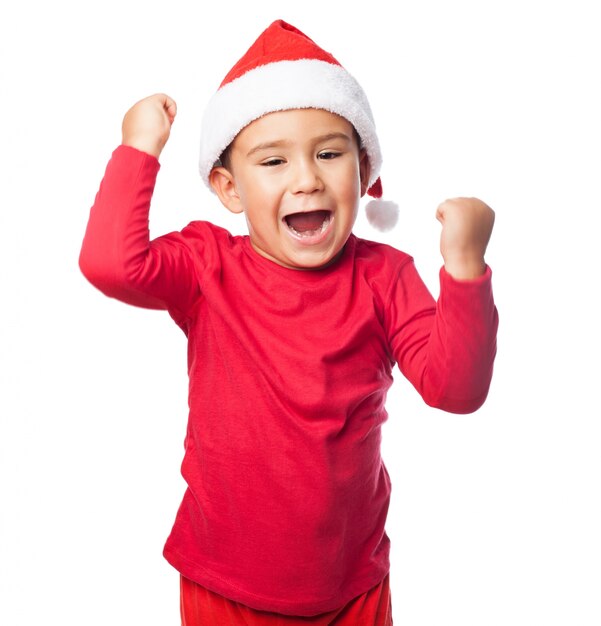 Successful child with santa claus hat