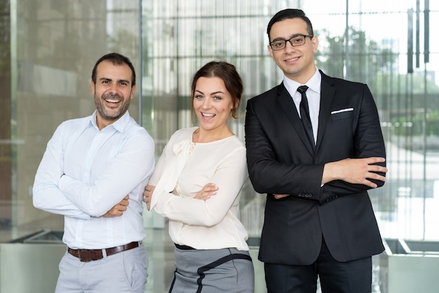 Successful confident business people smiling at camera