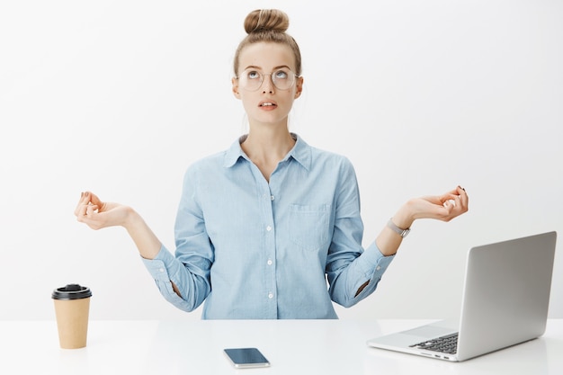 Free Photo successful female entrepreneur in blue collar shirt