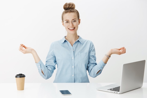 Free Photo successful female entrepreneur in blue collar shirt