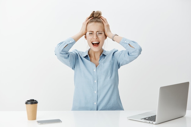 Free photo successful female entrepreneur in blue collar shirt