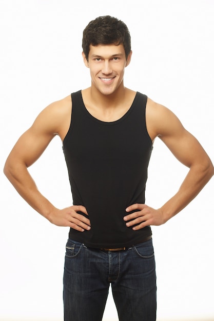 Free photo successful muscled young man in black tanktop