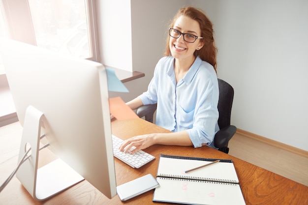 Free Photo successful pretty businesswoman working on the computer in the office