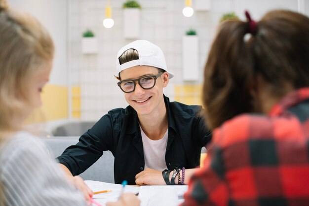 Successful student posing at table