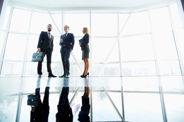 Successful workers standing in the room