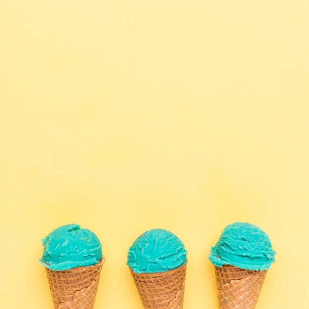 Free photo sugar cornets with turquoise ice cream