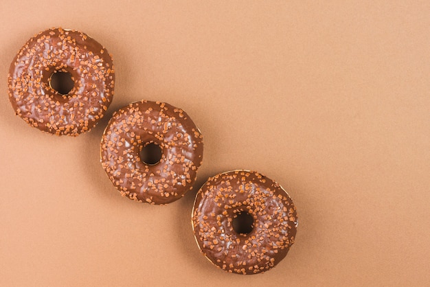 Free photo sugar donuts with dark chocolate glaze and sprinkles