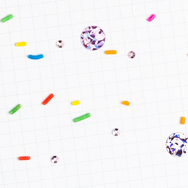 Free photo sugar sprinkles white grid background