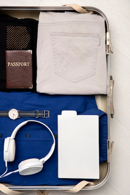 Suitcase packed with travel paraphernalia