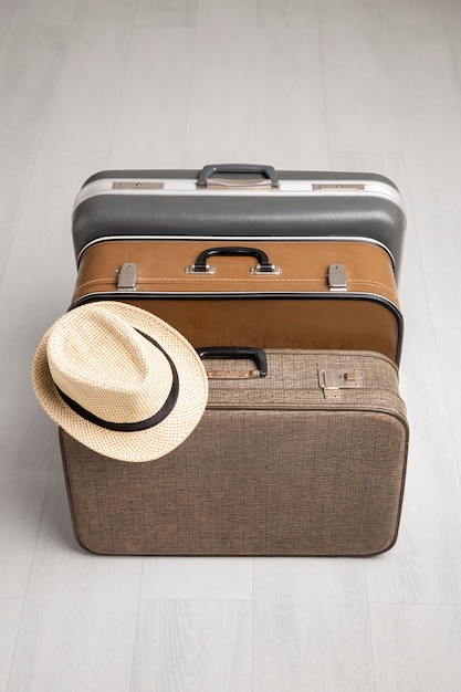 Suitcases for travel with straw hat