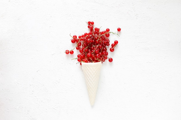 Summer berries golden raspberries, red currant on white