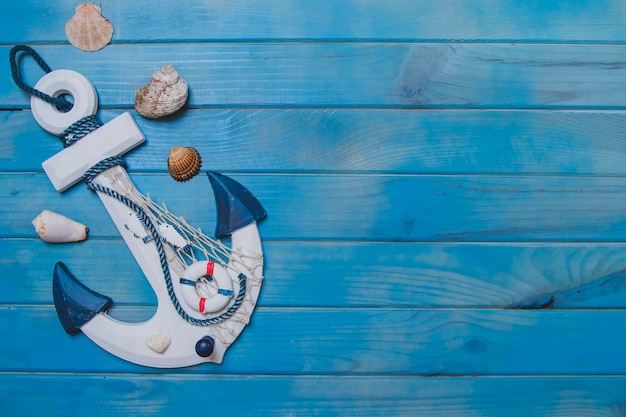 Free Photo summer composition with anchor, seashells and blank space