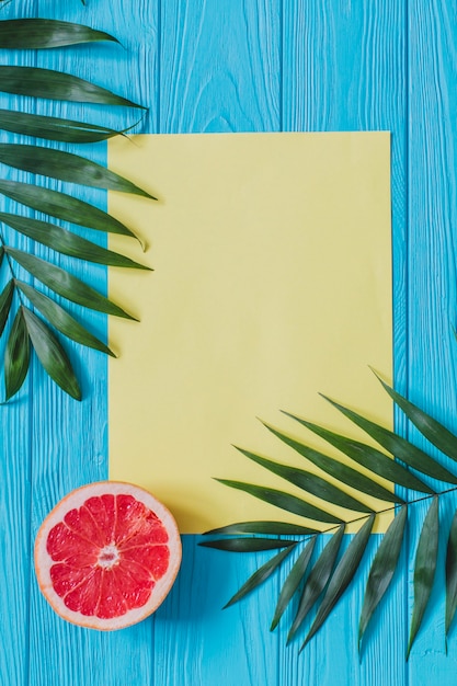 Free Photo summer composition with blank paper and grapefruit