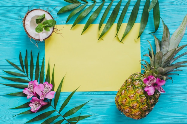 Free photo summer composition with yellow paper and fruits