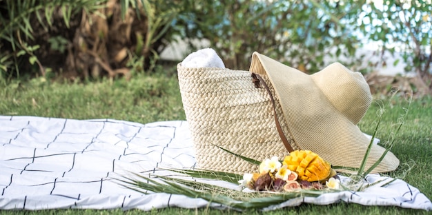 Summer picnic with a plate of tropical fruits.